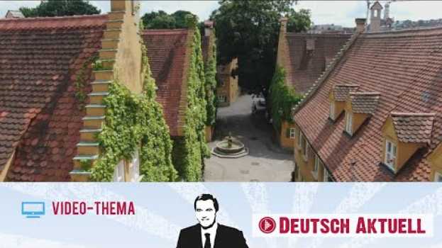 Video Deutsch lernen mit Videos | Die Fuggerei: Soziales Wohnen seit 500 Jahren | mit deutschen UTs in English