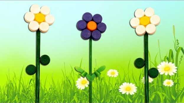 Video Fleur faite avec des bouchons en plastique DIY auf Deutsch